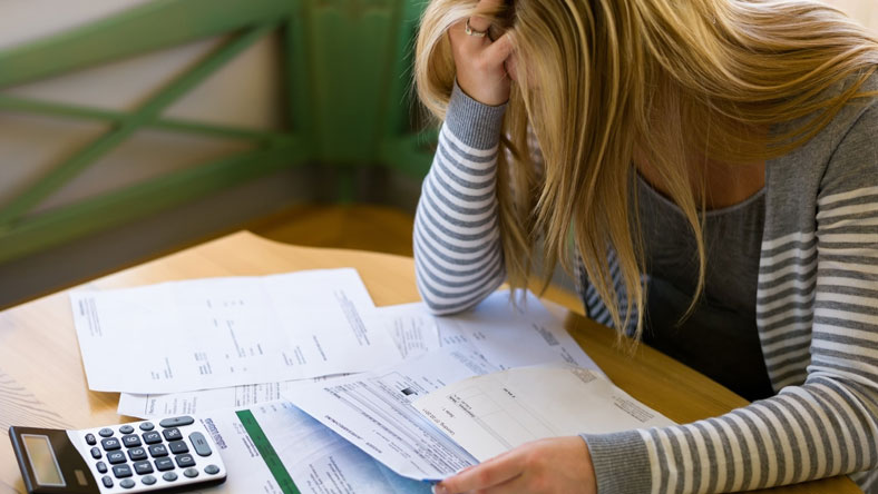 Woman stressed out over bills