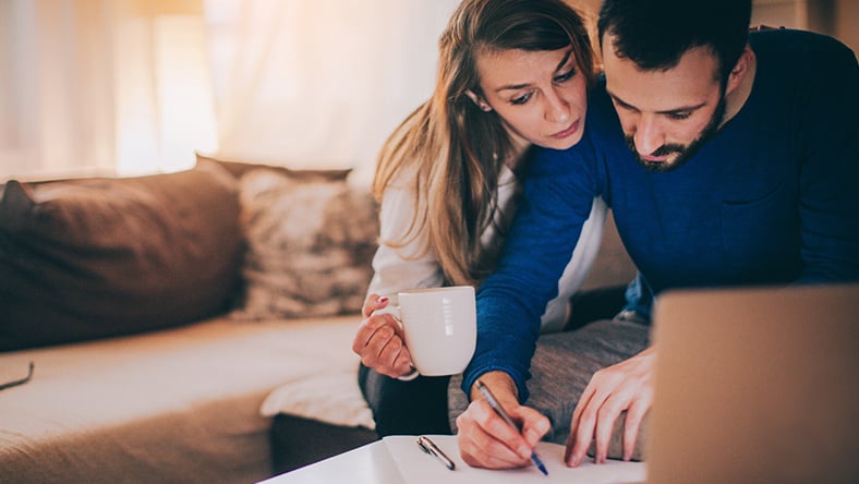 A couple reviewing some information