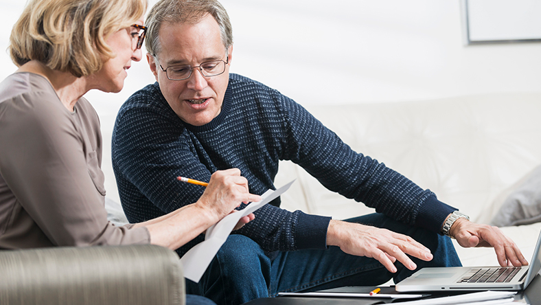 An older couple reviewing their finances