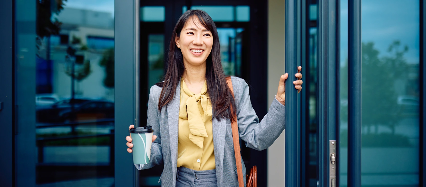 Professional arriving at an office building before work.
