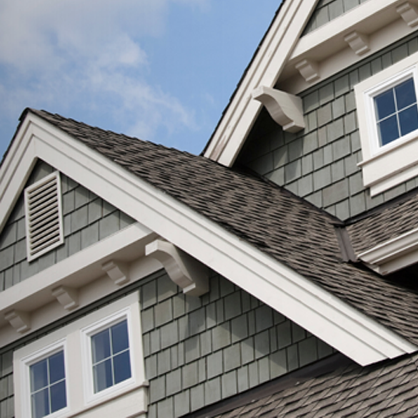 Roofline of a home with blue skies.